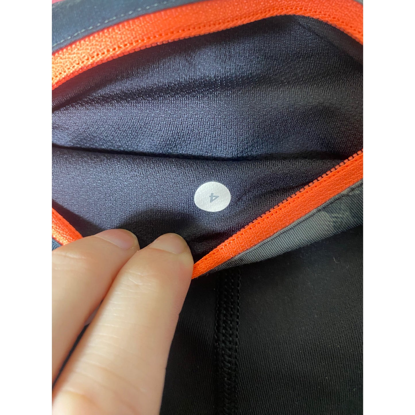 Lulu Lemon Black Leggings w Peach Accents at waist and lower calf. Sz 4